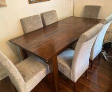 Rosewood dining table and six chairs