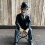 Charlie Chaplin resin sculpture figurine in metal chair Image 2