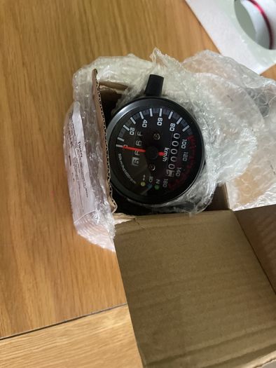 speedo clock brand new has mounting bracket and never fitted