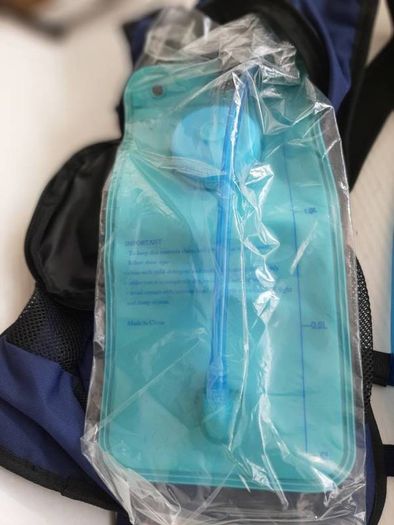 new navy hydrational bag pack tag attached