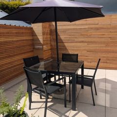 Black Table and Chairs 4 seater glass top table & black parasol