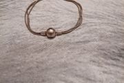 Silver tone bracelet with ball clasp