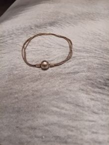 Silver tone bracelet with ball clasp