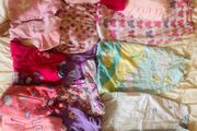 10 all in ones, 3 baby sleep bag, 4 pink blankets