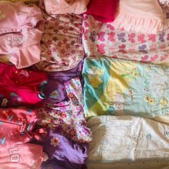 10 all in ones, 3 baby sleep bag, 4 pink blankets