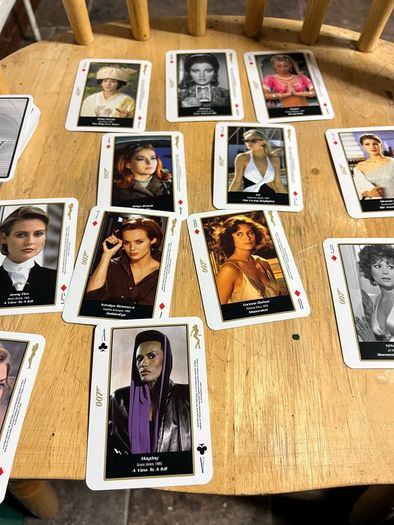 OO7 Bond girls playing cards