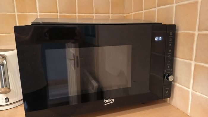 For sale: Beko MGB25332BG built-in microwave with grill, stainless steel finish.