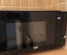 For sale: Beko MGB25332BG built-in microwave with grill, stainless steel finish.