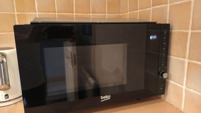 For sale: Beko MGB25332BG built-in microwave with grill, stainless steel finish.