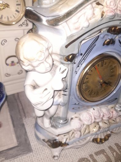 Porcelain Mantel Clock with Two Cherubs and Two Doves on top, and floral accents, Postage Available