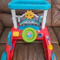 Fisher-Price 2-Sided Steady Speed Baby Walker with Songs and Phrases