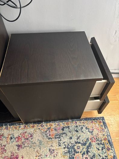 drawers in a black-brown wood veneer finish glass top