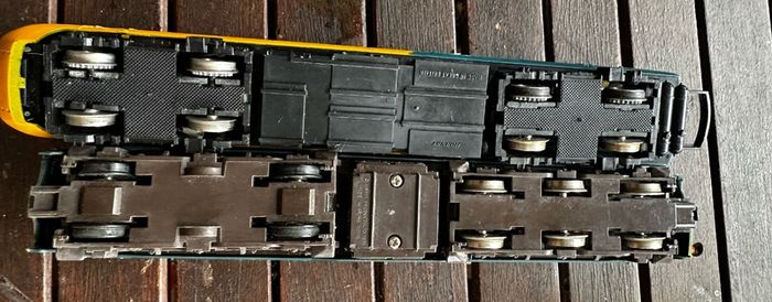 2 Hornby British rail engines and 2 British rail coaches. Don't have a controller so don't know if they work or not Hornby train