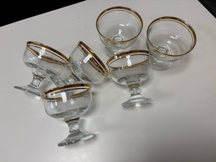 Set of six clear glass footed dessert dishes with gold-trimmed rims