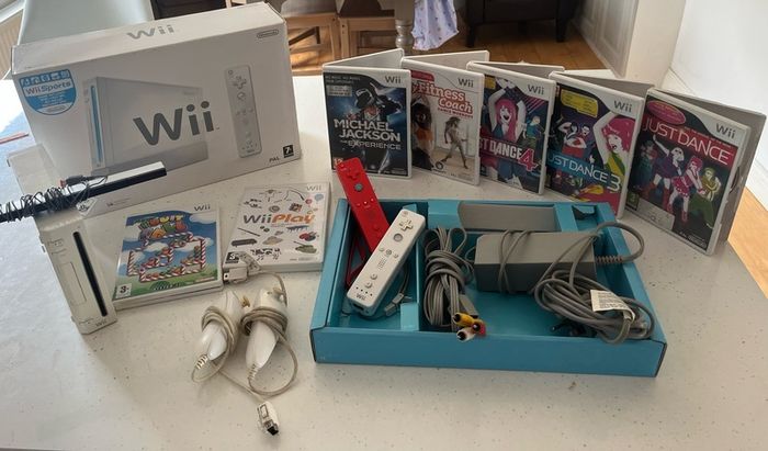 wii console , games and 2 controllers
