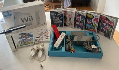 wii console , games and 2 controllers