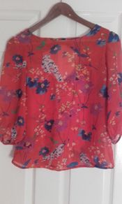 Orange blouse with flowers