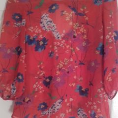 Orange blouse with flowers