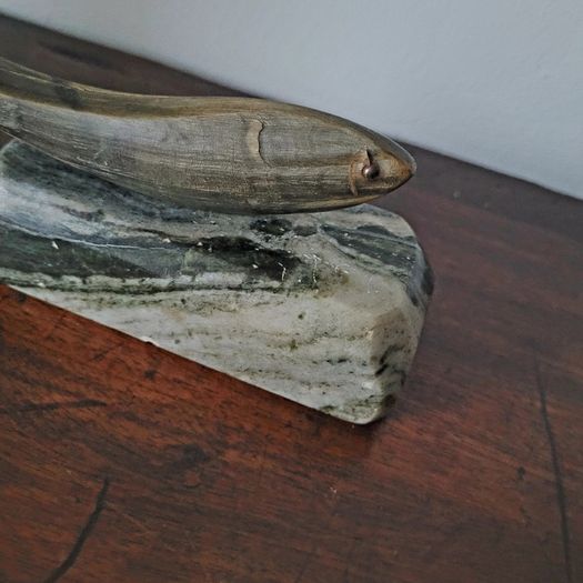 Vintage fish sculpture on marble