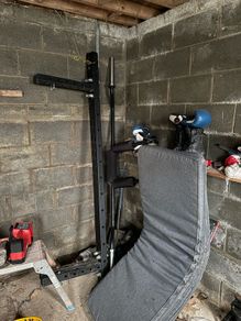 Wall mounted folding squat rack