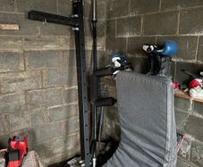 Wall mounted folding squat rack