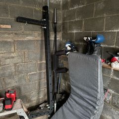 Wall mounted folding squat rack