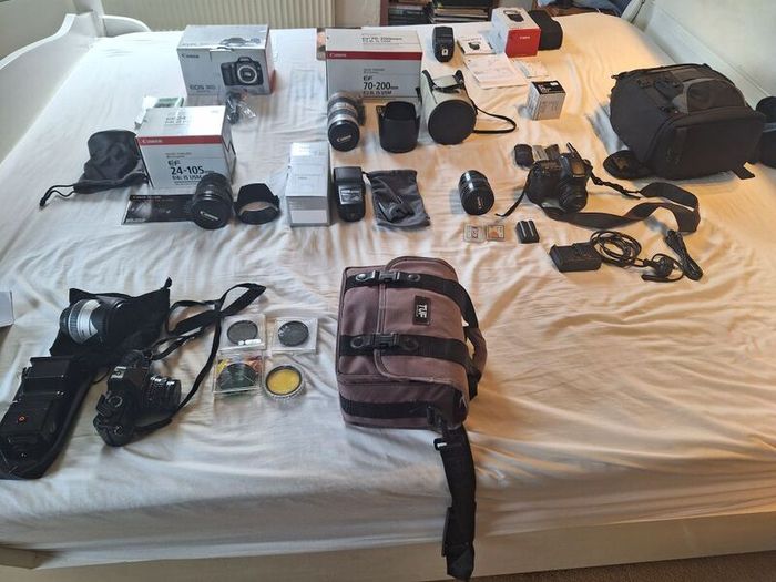 canon camera and pro lenses and a Pentax film system