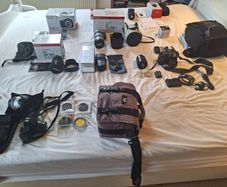canon camera and pro lenses and a Pentax film system