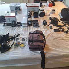 canon camera and pro lenses and a Pentax film system