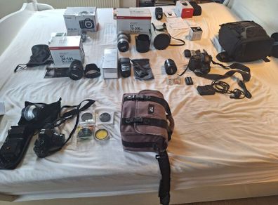 canon camera and pro lenses and a Pentax film system
