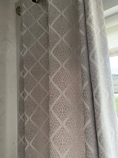 Grey patterned eyelet curtains