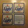 Guinness Light pint glass and beer mats Image 3