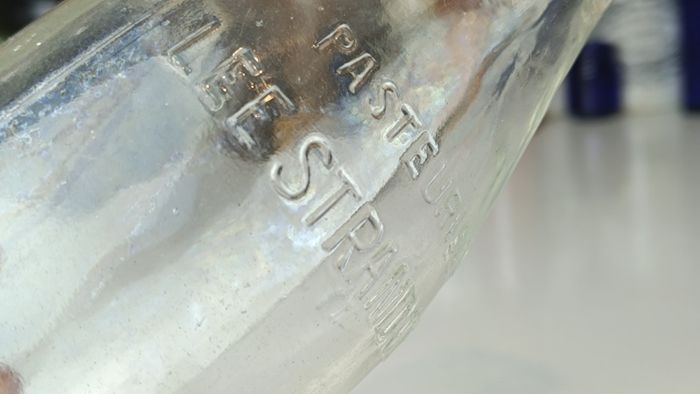 502 - Vintage Clear Glass Cork Top Collectible Decorative Lee Strand Creamery Milk Bottle