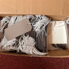Box of strung tags/labels
