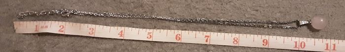 selection of homemade white metal necklaces