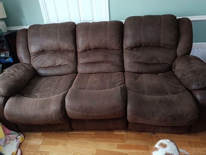 Brown fabric reclining sofa and armchair