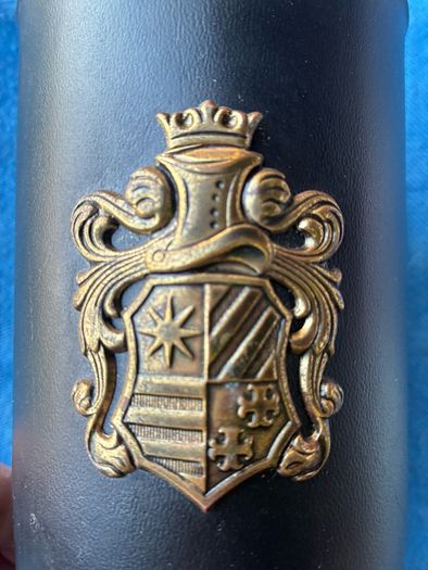 Vintage pint glass in leather holder