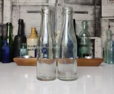 385 - Set of 2 Vintage Collectible Decorative Clear Glass Cantrell and Cochrane Mineral Bottles
