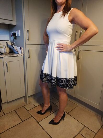 White dress with black lace trim