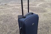 Old travelog suitcase and trolley