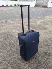 Old travelog suitcase and trolley