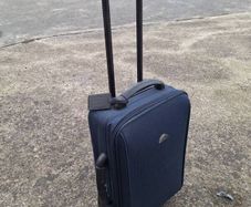 Old travelog suitcase and trolley