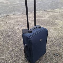 Old travelog suitcase and trolley