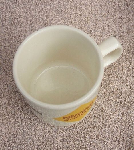 NIZORAL SHAMPOO (Janssen) - a scarce promotional mug made by Carrigdhoun Co-Op pottery of Carrigaline, County Cork (late 1980s)