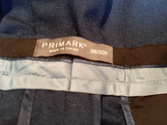 New navy trousers tag attached