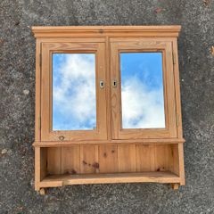 Pine bathroom cabinet with mirror doors