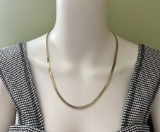 Gold tone snake chain necklace