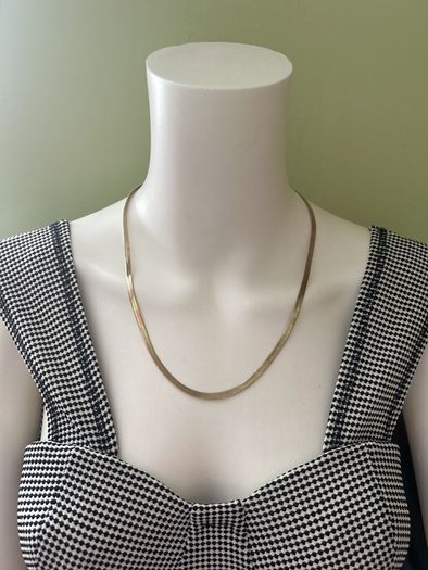 Gold tone snake chain necklace