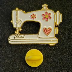 Sewing machine, pin back badge.