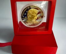 Red Box with Trump Commemorative Coin, new, unopened.